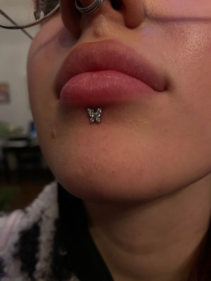 a close up of a person with a nose piercing