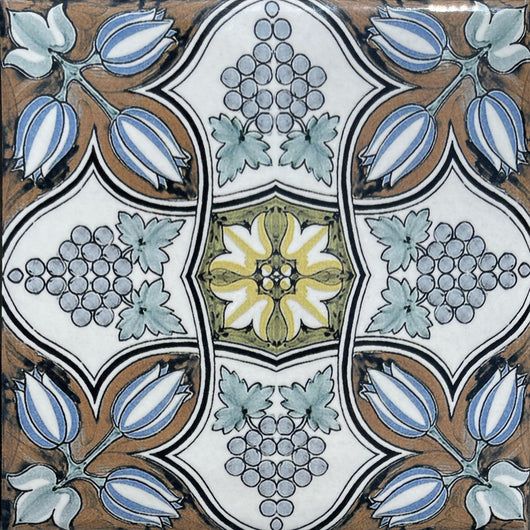 an artistic tile design with blue and yellow flowers on the bottom, surrounded by leaves