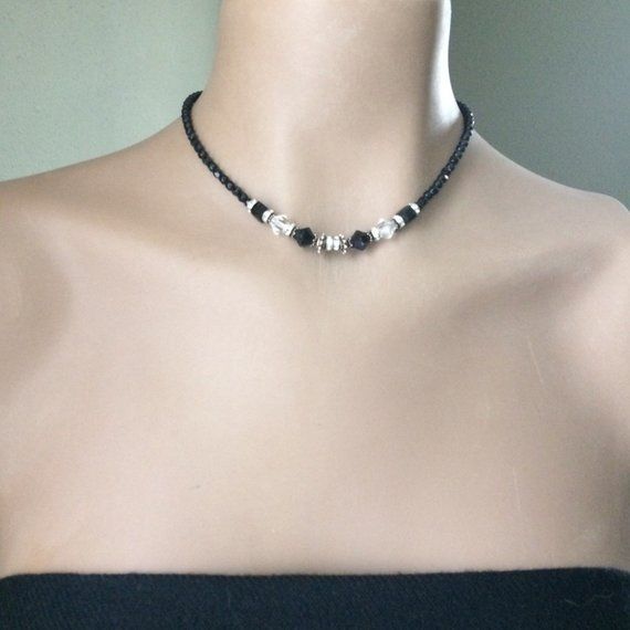 Really pretty (handmade ?) black and clear crystal choker. Various sized and shaped black crystal beads with clear crystal and rhinestone accent beads with ornate silver tone spacers. Toggle closure. Necklace measures approx. 15 inches.Condition is very good vintage. As found. I leave decision of cleaning up to buyer. Black Faceted Beads Choker, Black Rhinestone Choker Jewelry, Silver Faceted Beads Choker, Adjustable Silver Choker With Black Beads, Adjustable Silver Choker With Spacer Beads, Adjustable Beaded Crystal Choker, Rhinestone Choker, Crystal Choker, Garnet Rings