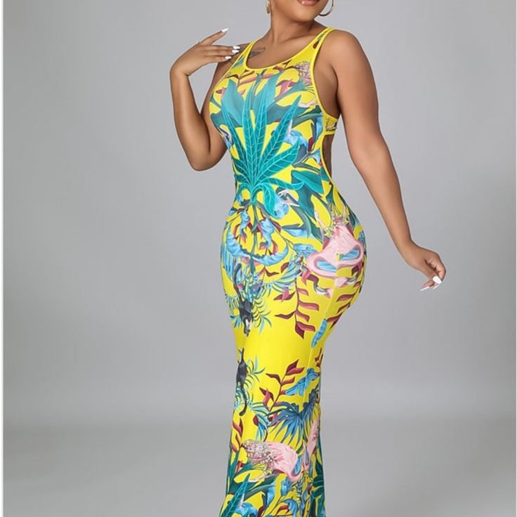 Stretch Dress Round Neckline Sleeveless Backless No Closure 95% Polyester 5% Spandex Hand Wash Cold Model Is Wearing A Small Yellow Sleeveless Midi Dress For Party, Yellow Fitted Halter Neck Maxi Dress, Yellow Halter Neck Sleeveless Dress For Spring, Yellow Floral Print Sleeveless Party Dress, Fitted Yellow Floral Print Sleeveless Dress, Fitted Yellow Sleeveless Dress With Floral Print, Yellow Fitted Floral Print Sleeveless Dress, Fitted Yellow Sleeveless Dress, Yellow Stretch Floral Print Dress