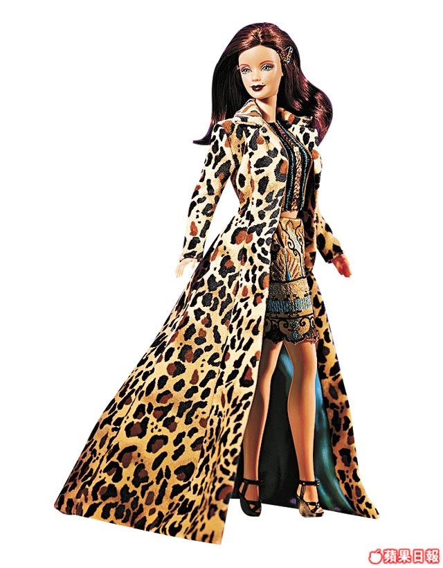 a barbie doll wearing a leopard print dress