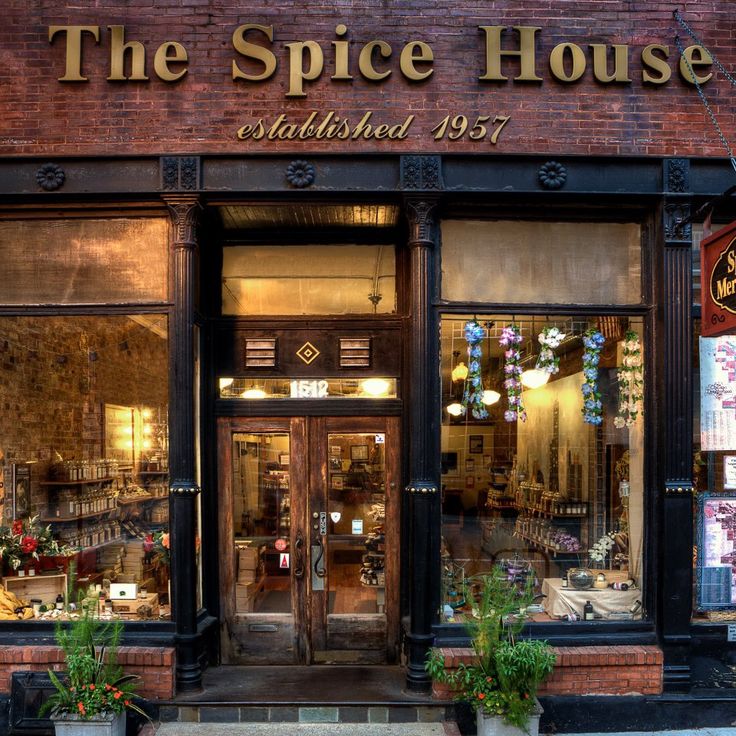 the spice house is located in an old brick building with many windows and plants outside