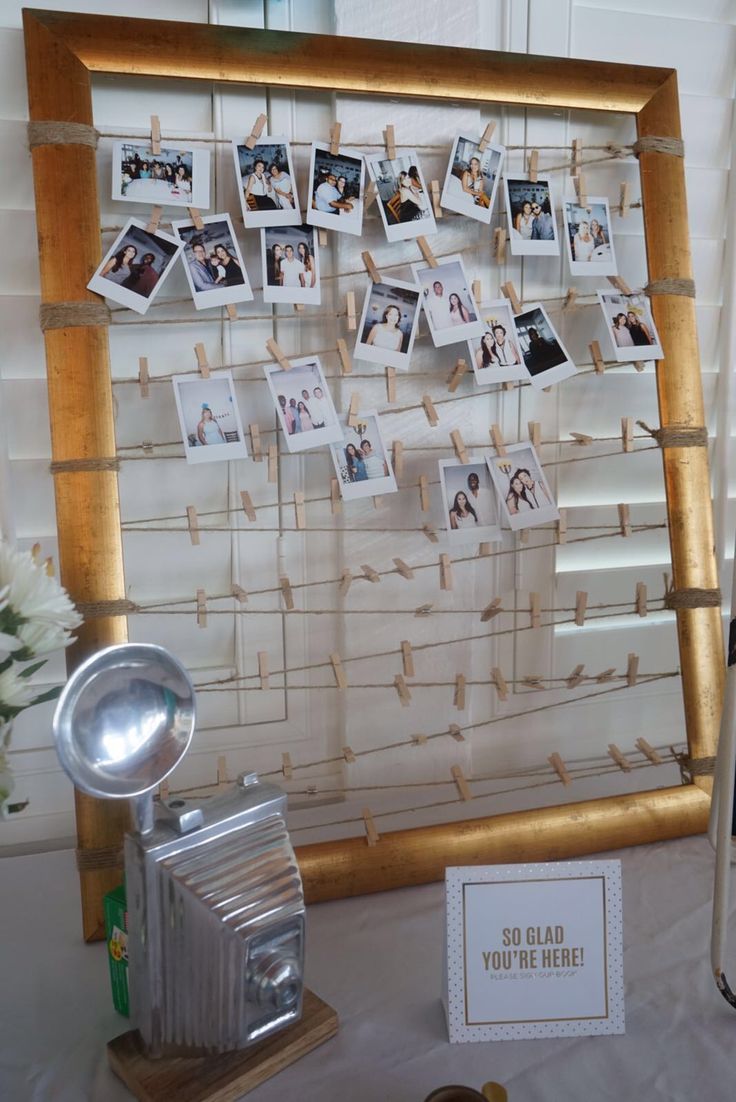 a photo frame with pictures hanging on it