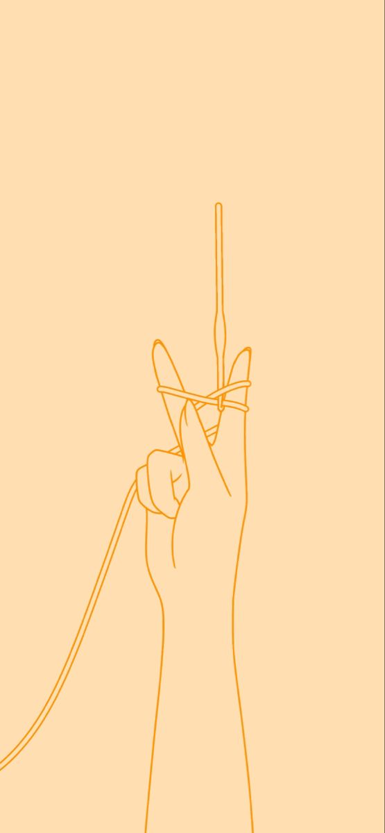 a hand holding a phone up in the air with a cord attached to it's side