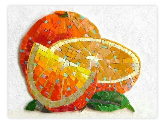 two oranges made out of mosaic tiles