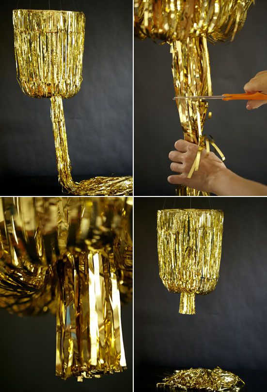 the process of making a chandelier with gold tinsel and plastic straws