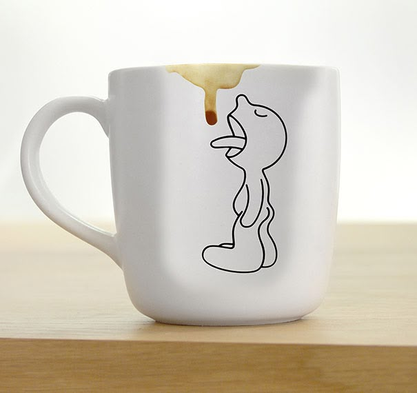 a white coffee mug with a drawing of a cat on it's side and honey dripping from its mouth