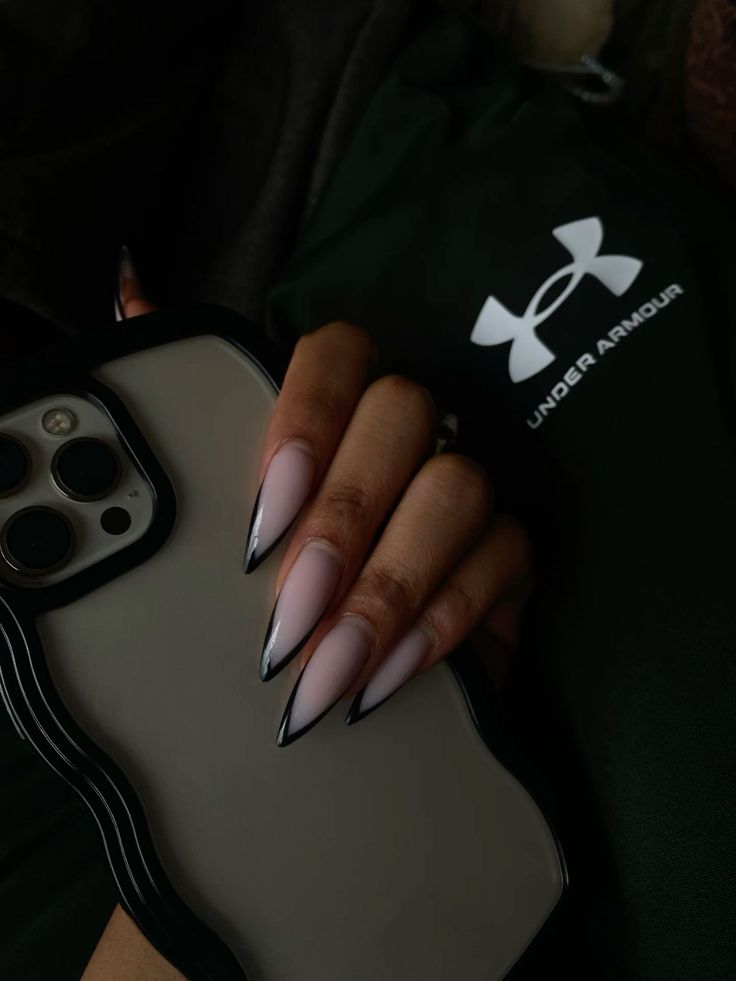 Stiletto nails Milky White Nails With Black French Tip, Curved Nails French Tip, Curved Stilleto Acrylic Nails, Stellitoes Nails Simple, Black Stiletto French Tip Nails, Stiletto Nails Classy, Black Tip Stiletto Nails, Medium Stiletto Nails Designs, Black French Tip Nails Stiletto