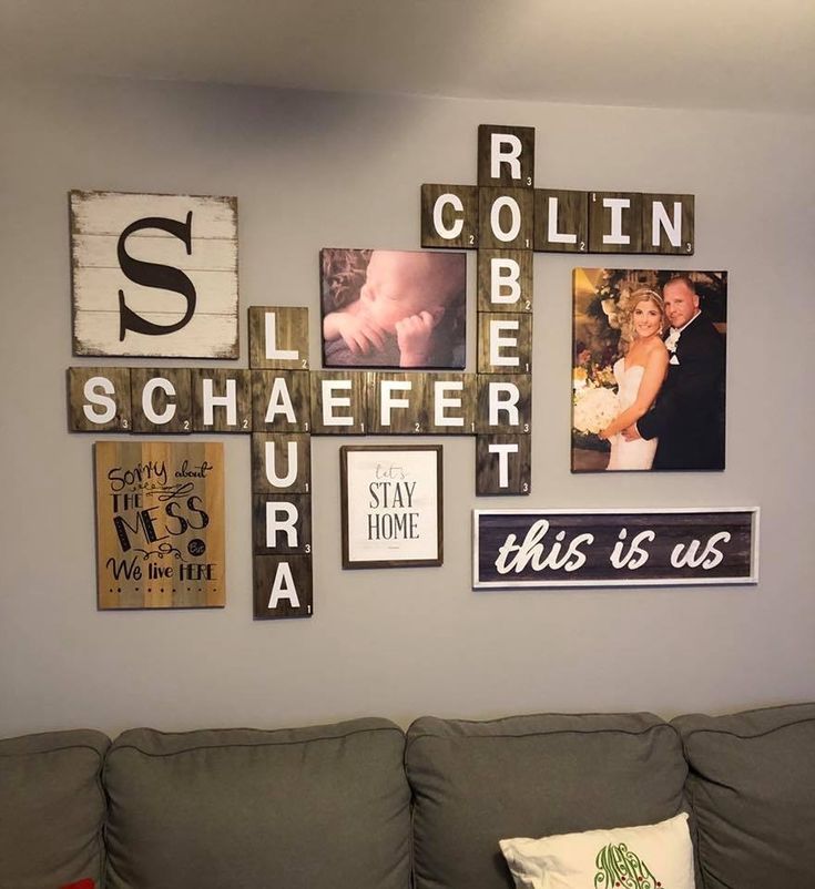 a living room filled with furniture and pictures on the wall