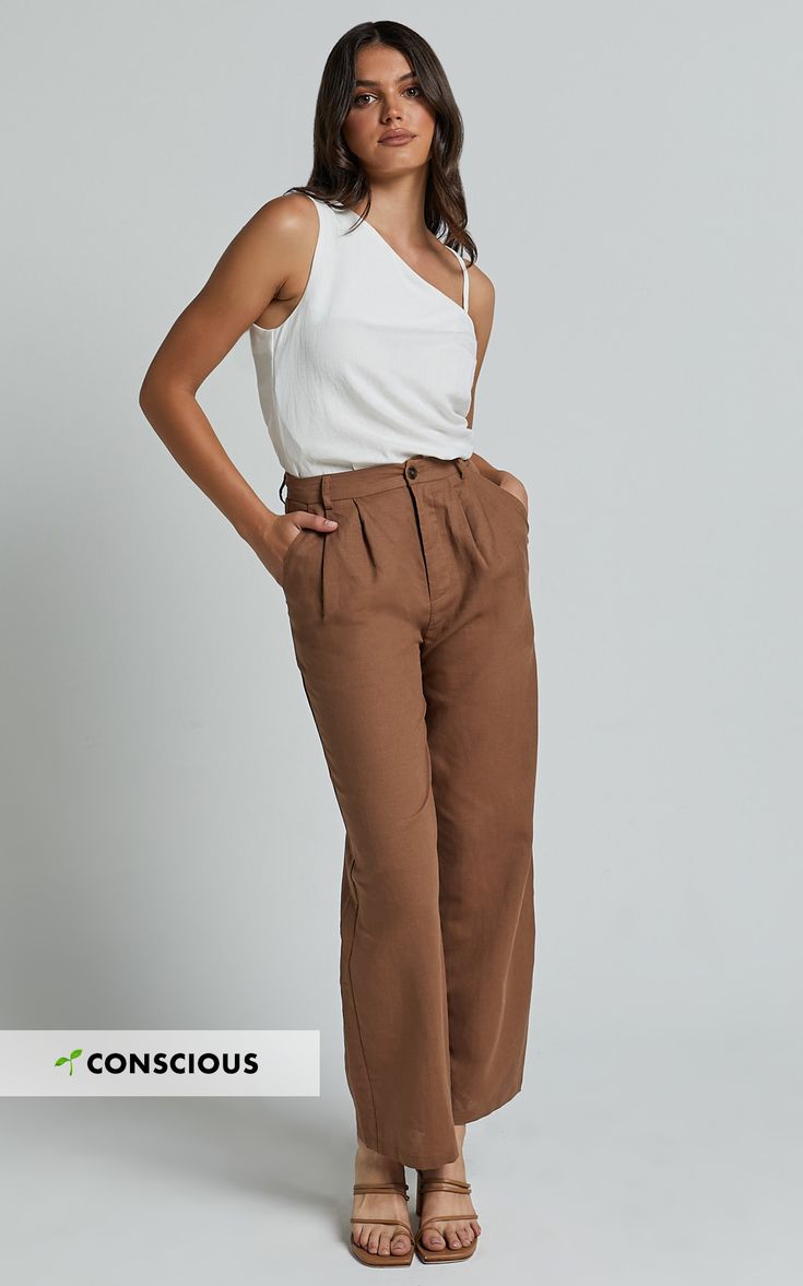 Get ready to elevate your workwear game with our Celenia Pants in Brown. These high-waisted, wide-leg pants are the perfect combination of comfort and style, making them a must-have addition to your wardrobe. Made from premium linen fabric, these pants are not only breathable but also incredibly soft against the skin. The relaxed fit allows for ease of movement, while the full length adds a touch of sophistication. Whether you're heading into the office or stepping out for a brunch date, our Cel High Waisted Wide Leg Pants, Relax Pants, Brunch Date, Stepping Out, Pant Style, Body Measurements, Fashion Pants, Linen Fabric, Leg Pants