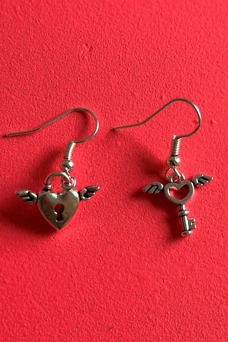 The cutest pair of earrings for valentines day or to show to your special someone/bestie how much they mean to you. Heart Charm Metal Earrings For Gift, Cute Party Earrings For Mother's Day, Cute Earrings For Mother's Day Party, Heart Earrings For Mother's Day Party, Silver Heart Earrings For Party, Cute Anniversary Jewelry For Valentine's Day, Heart Shaped Metal Earrings For Valentine's Day, Heart-shaped Metal Earrings For Valentine's Day, Valentine's Day Pierced Drop Earrings