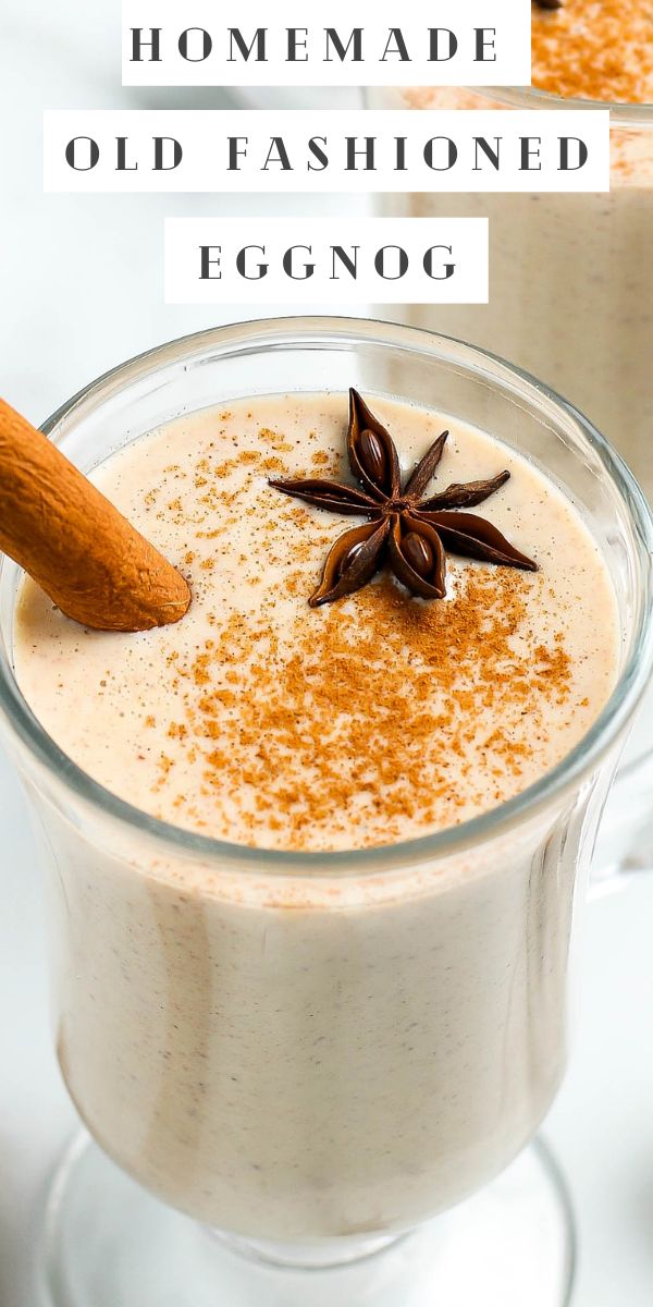 homemade old fashioned eggnog in a glass mug with an orange star on top