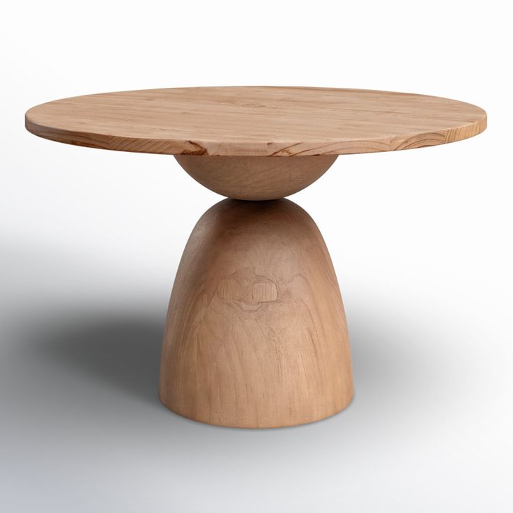 a wooden table sitting on top of a white floor