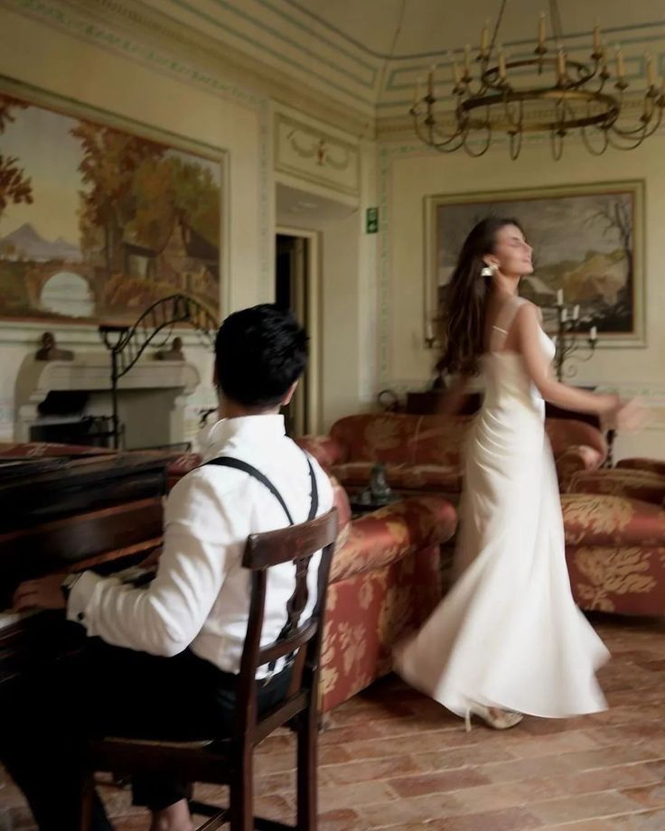 a bride and groom are sitting at the piano