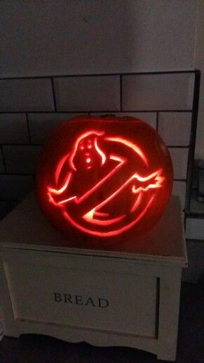 a carved pumpkin sitting on top of a white box