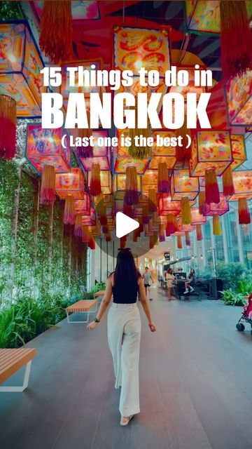 a woman walking down a walkway with lots of lanterns hanging from the ceiling and text that reads 15 things to do in bangkok last one is the best?