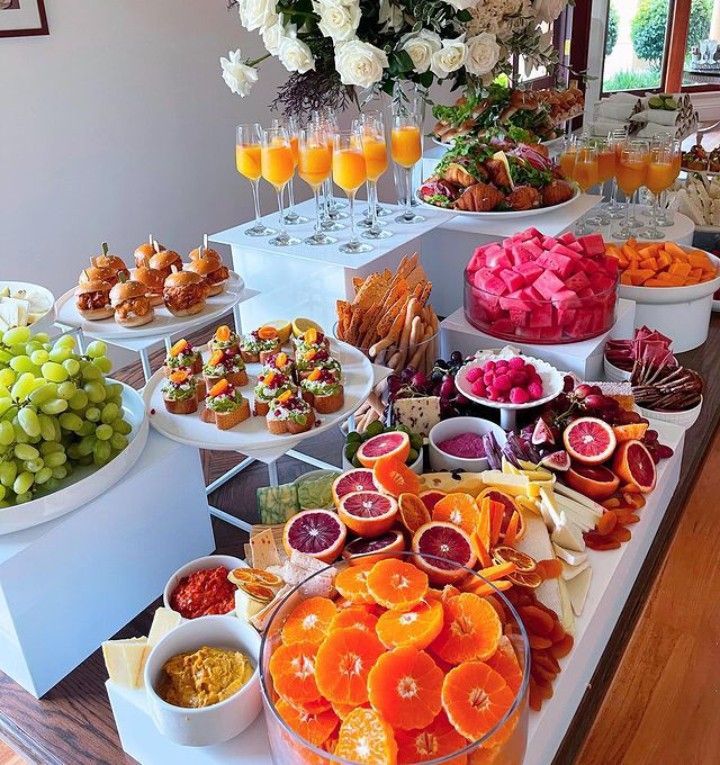 a table filled with lots of different types of food and drinks on it's sides