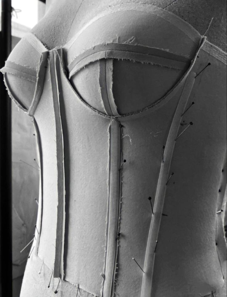 the back of a woman's corset is shown in black and white