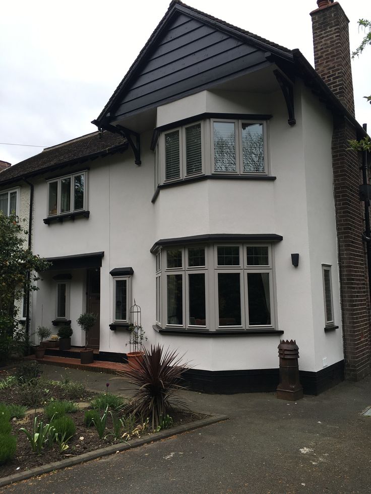 a white house with black trim and windows