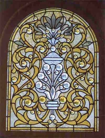 a stained glass window with an ornate design