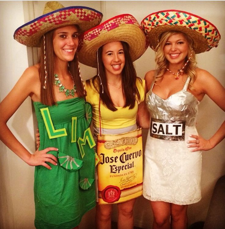 three women wearing sombreros posing for the camera