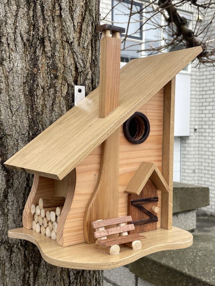 a bird house made out of wood on a tree