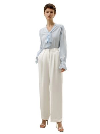 The palace pleat design on the cuffs adds an extra element of sophistication, creating an atmosphere of refined elegance. Whether it's for work or casual outings, this blouse is versatile and suitable for any occasion. 23MM Ghost Crepe V-neck Neckline ribbon Pleated cuffs Suitable for casual work and vacations Elegant V-neck Top With Cuffed Sleeves, Elegant Pleated Silk Tops, Elegant Pleated Formal Tops, Chic Formal Blouse With Button Cuffs, Elegant Viscose Blouse For Business Casual, Elegant Blue Blouse With Pleated Sleeves, Elegant Evening Blouse With Pleated Sleeves, Elegant Workwear Tops With Button Cuffs, Elegant Tops With Button Cuffs For Work