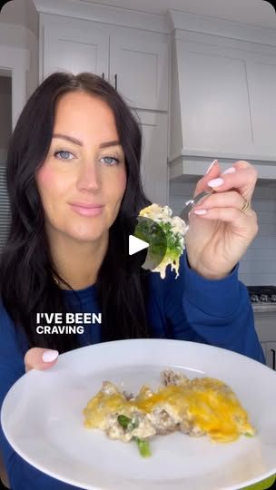 a woman eating food from a white plate in the middle of a kitchen with words above her