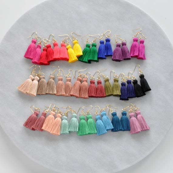 These handmade tassel earrings will make a big style impact, whether you’re wearing them with jeans and a t-shirt or with a dress. At less than one-tenth of an ounce, Libby & Smee statement earrings feel virtually weightless!+ super lightweight cotton tassel in a choice of 25 different colors+ gold-plated stainless steel ear wire hooks (lead-free and nickel-free)+ comes with plastic earring back for security+ MINI is 2.5 inches and LONG is 3.25 from the top of the ear wire    (each piece is hand Girls Trip Gifts, Plastic Earrings, Earring Cards, Bohemian Earrings, Bijoux Diy, Diy Earrings, Earring Backs, Tassel Earrings, Ear Wire