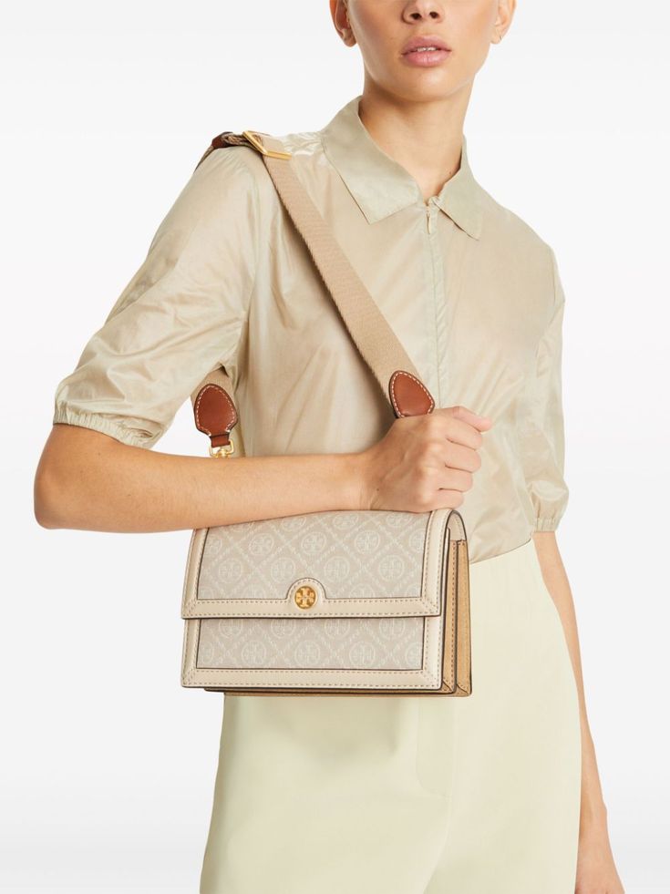 Find TORY BURCH T Monogram Shoulder Bag on Editorialist. The Tory Burch T Monogram Shoulder Bag is crafted from patterned jacquard with a leather trim. The bag features the signature Double T motif, gold-tone hardware, and an adjustable, detachable shoulder strap. The interior of the bag includes a partitioned compartment and an internal zip-fastening pocket. T Monogram, Leather Trim, Leather Trims, Tory Burch, Top Brands, Shoulder Strap, Monogram, Trim, Shoulder Bag