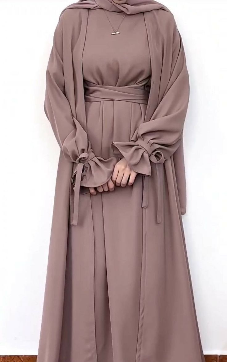 Three Pc Modest Wear Set.Includes belted inner. Outer coat. Hijab.A beautiful simple & elegant abaya... Elegant Solid Abaya For Fall, Elegant Solid Color Abaya For Fall, Elegant Belted Abaya, Elegant Abaya With Kimono Sleeves For Eid, Chic Long Abaya For Eid, Eid Elegant Abaya With Kimono Sleeves, Eid Abaya With Kimono Sleeves And Elegant Style, Elegant Long Winter Abaya, Elegant Long Sleeve Brown Abaya