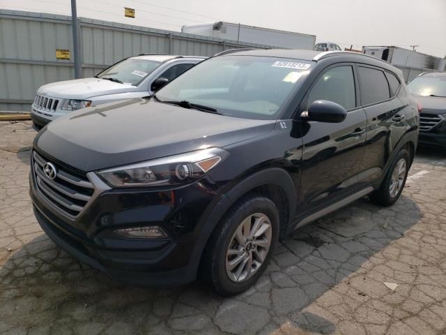 the front end of a black car parked in a lot with other cars behind it