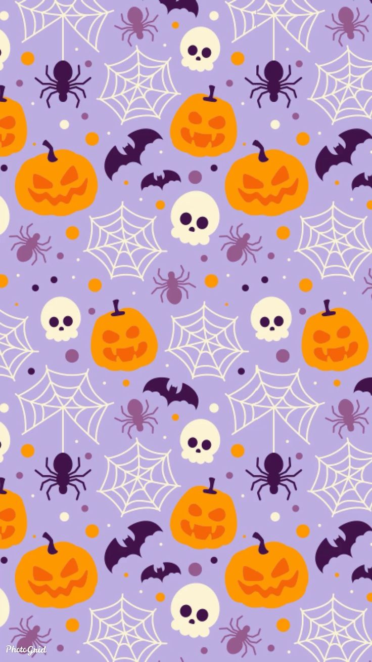 halloween seamless background with pumpkins and skulls on purple, white and orange colors