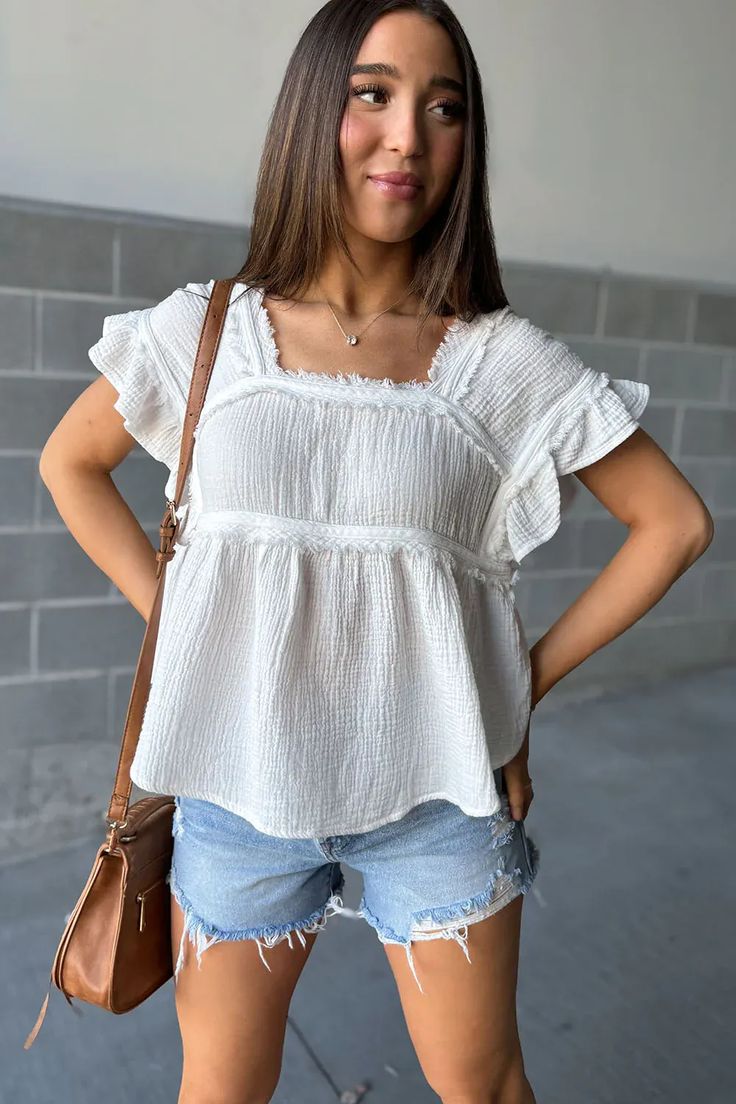 White Ruffle Raw Hem Peplum Top | Lillian Top - White – Mindy Mae's Market Summer Ruffle Top With Flutter Sleeves, Summer Tops With Ruffles And Flutter Sleeves, Trendy Ruffle Sleeve Tops For Summer, Summer Tops With Ruffle Sleeves For Day Out, Ruffle Sleeve Tops For Summer Day Out, Spring Vacation Tops With Ruffle Sleeves, Vacation Tops With Ruffle Hem And Flutter Sleeves, Casual Cotton Flutter Sleeve Tops, Vacation Flutter Sleeve Top With Ruffle Hem