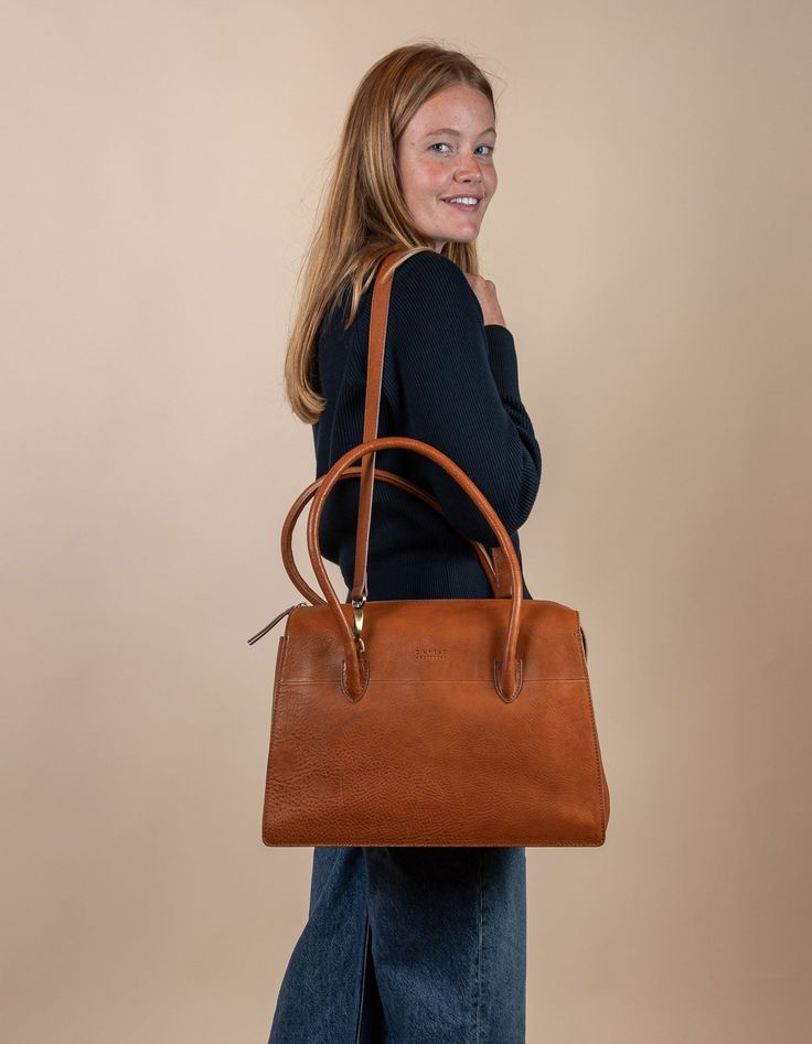 Kate Cognac Stromboli Leather Crossbody Shoulder Bag with Large Straps by O My Bag. Model image Cognac Satchel For Workwear, Timeless Cognac Briefcase For Everyday Use, Modern Everyday Cognac Briefcase, Cognac Satchel With Smooth Grain For Work, Cognac Shoulder Satchel For Work, Cognac Shoulder Satchel For Workwear, Everyday Cognac Briefcase With Top Handle, Cognac Smooth Grain Top Handle Satchel, Elegant Cognac Satchel For Daily Use