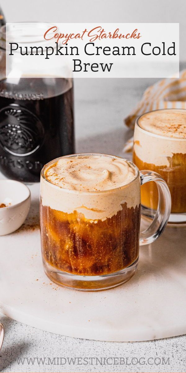 two mugs filled with pumpkin cream cold brew sitting on a table next to other drinks