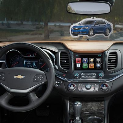 the interior of a car with an image of a blue chevy suv on it's dashboard