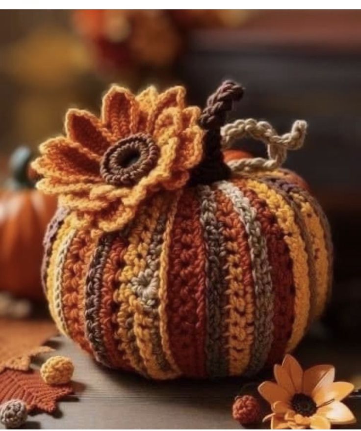 a crocheted pumpkin sitting on top of a table