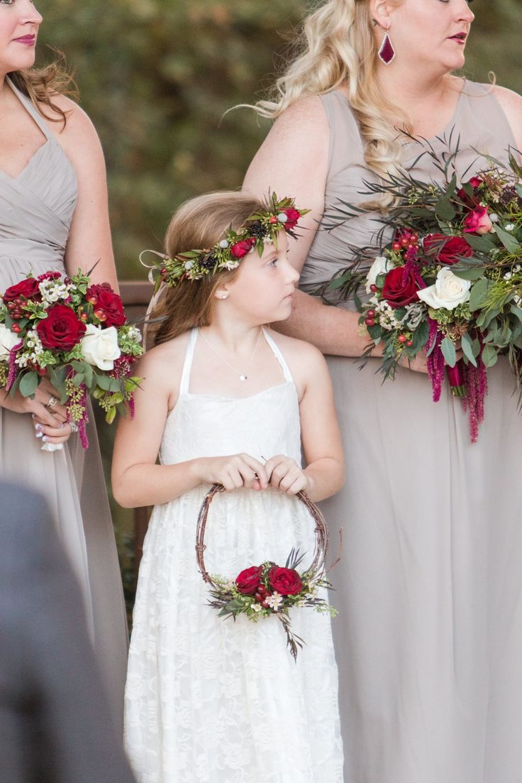 the bridesmaids are holding their bouquets and looking at each other in different directions