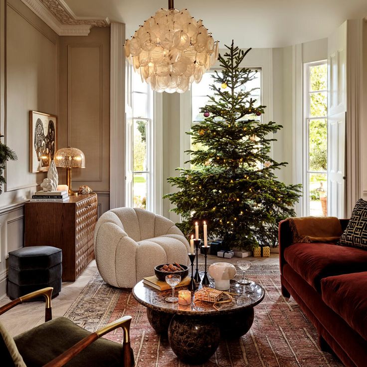 a living room filled with furniture and a christmas tree in the middle of the room