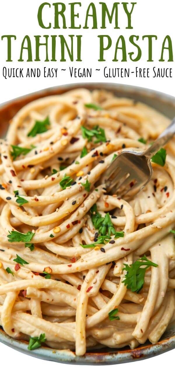 creamy tahini pasta in a bowl with a fork