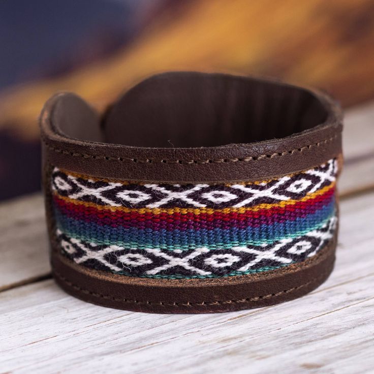 a brown leather bracelet with multicolored beads