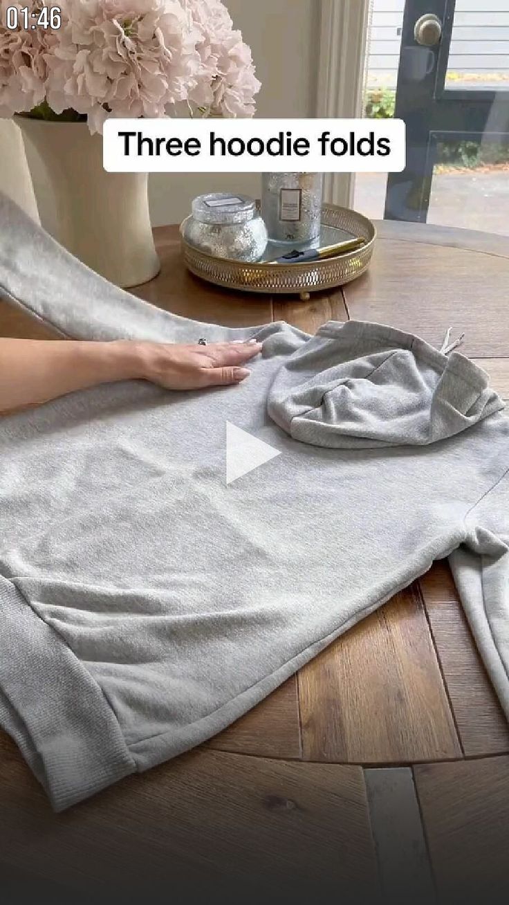 a woman is laying on the floor with her feet propped up next to a towel