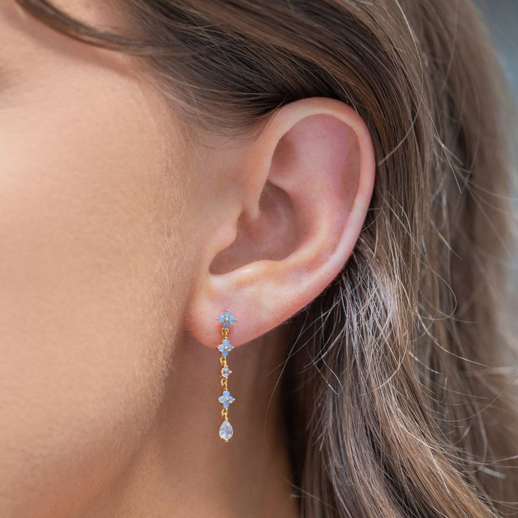 Take beauty wherever you go in the Blue Blossom Love Dangle Earrings. This design has become a GC favorite and is here to stay! You'll get lost in the stunning and calming baby blue hues of the cubic zirconia stones. Something Blue Earrings, Baby Blue Earrings, Light Blue Jewelry, Light Blue Earrings, Blue Blossom, Blue Crystal Earrings, Senior Prom, Blossom Design, Necklace Chain Lengths