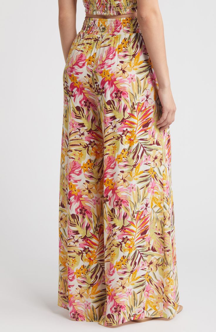 A wide, flowy silhouette catches every beachy breeze as you stroll the shore in these pants cut from an airy crinkled fabric with a vibrant floral pattern. Elastic waist Front slant pockets Lenzing™ EcoVero™ viscose Lenzing EcoVero viscose is a more-sustainably produced fiber made using pulp made from renewable wood sources Machine wash, line dry Imported Casual Tropical Print Pants For Beach Season, Summer Pants For Beach Party Vacation, Vacation Floral Print Wide Leg Pants, Spring Beach Party Pants With Elastic Waistband, Summer Pants For Beach Party, Summer Pants With Elastic Waistband For Beach Party, Beachy Pants For Summer Beach Party, Beachy Summer Pants For Beach Party, Summer Beach Party Pants For Vacation