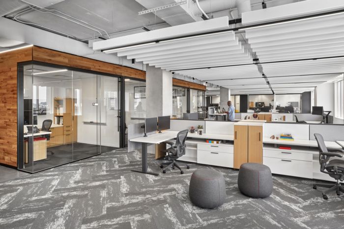 an office with two desks and chairs in it