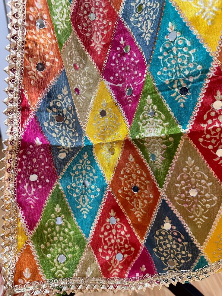 Experience the beauty of traditional Phulkari style with our Multicolor Dupatta. Made with a soft and luxurious silk finish, this dupatta features real mirror accents and stunning designs. Its heavy-weight construction makes it perfect for special occasions like Navaratri. Elevate your wardrobe with this must-have accessory. Approx 2.5 meters length Multicolor Anarkali Set With Traditional Drape For Eid, Multicolor Anarkali Set For Eid With Traditional Drape, Eid Anarkali Set With Traditional Drape In Multicolor, Traditional Anarkali Set With Mirror Work For Diwali, Festivals Semi-stitched Sharara With Motifs, Bohemian Salwar Kameez With Gota Work For Eid, Festive Anarkali Set With Gota Work, Bohemian Sharara With Dupatta In Traditional Drape, Bohemian Sharara With Dupatta And Traditional Drape