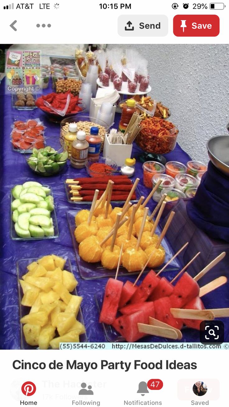 a table topped with lots of fruits and veggies on skewered sticks