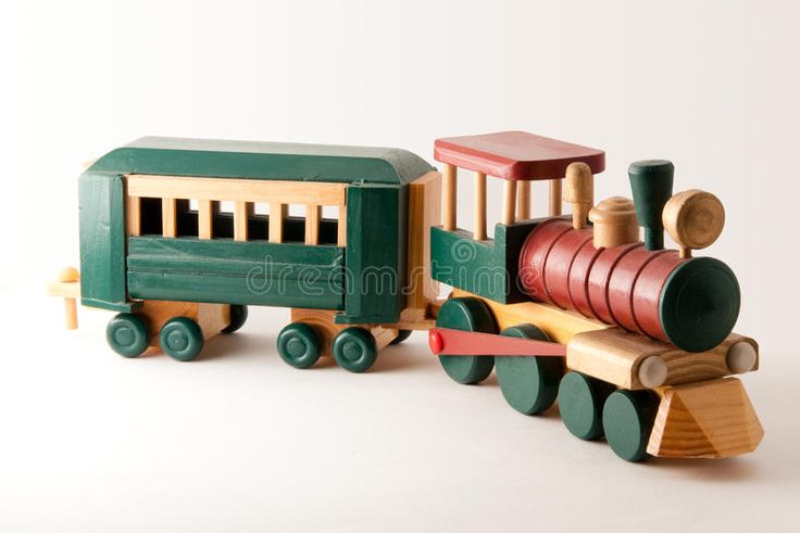 a wooden toy train is shown on a white background