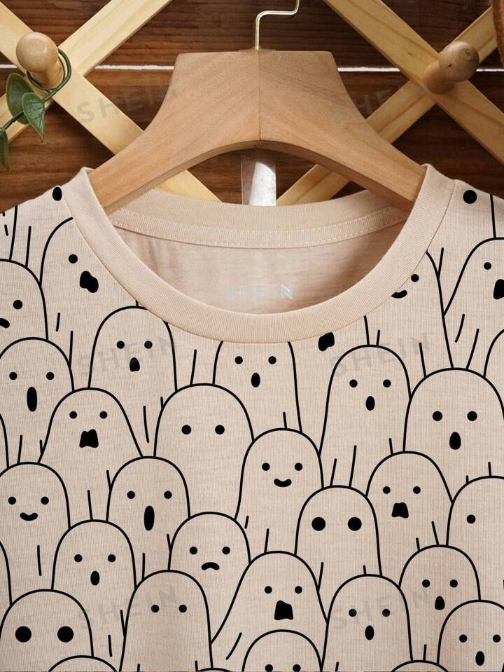 Fall Long Sleeve Tops With Funny Print, Oversized Long Sleeve T-shirt With Cartoon Print, Casual Long Sleeve Cartoon Print T-shirt, Beige Long Sleeve T-shirt With Graphic Print, Oversized Long Sleeve Top With Funny Print, Fall Cartoon Print Tops For Loungewear, Trendy Cartoon Print Tops For Fall, Beige Long Sleeve Tops With Graphic Print, Casual Tops With Cartoon Print For Loungewear